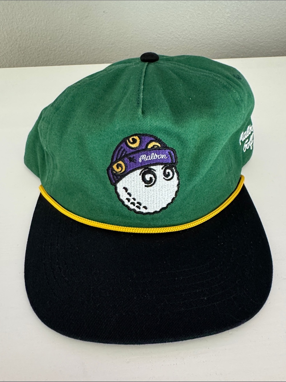 Green and Black Cap with Embroidered Golf Ball Logo - Unbranded